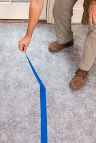 worker removing tape